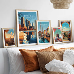 Detroit Print city poster and others framed on a wall with decorative pillows.
