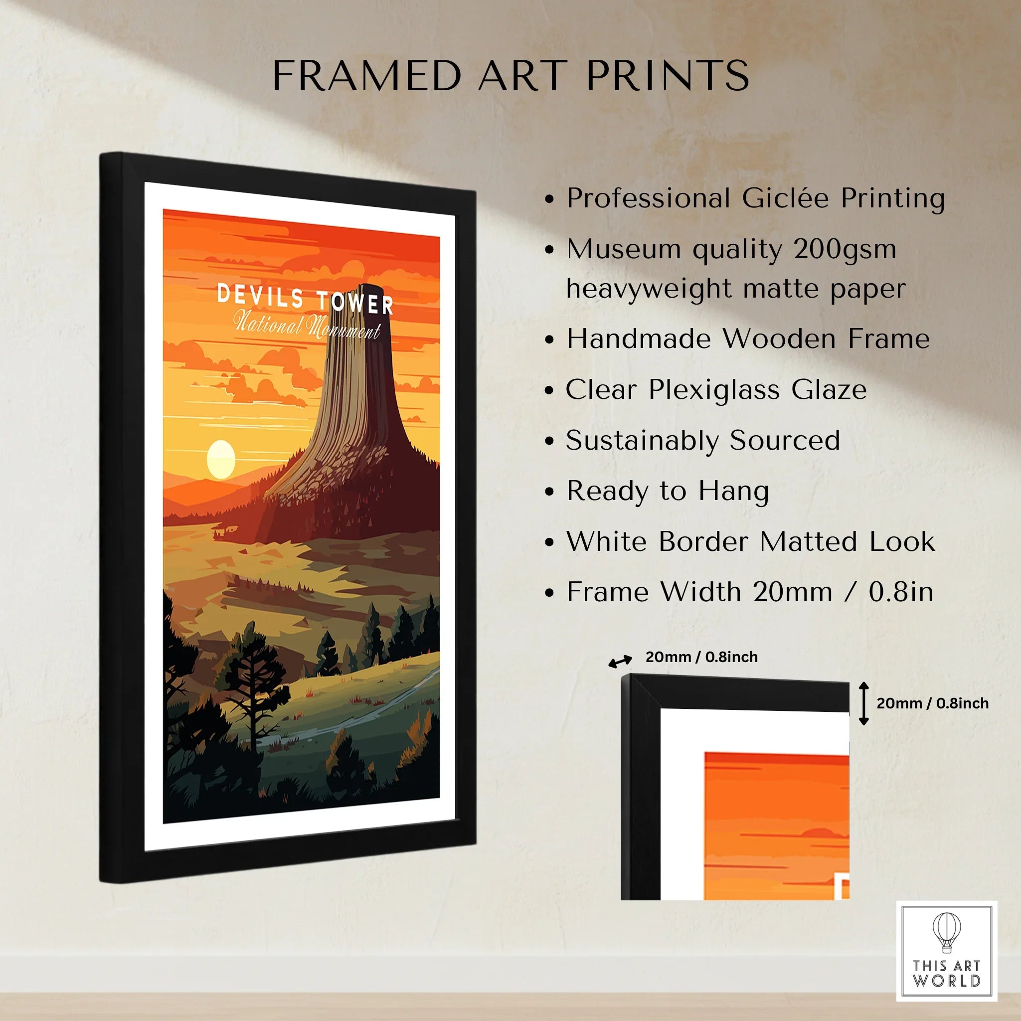 Framed Devils Tower National Monument art print with sunset landscape, white border, and black wooden frame.