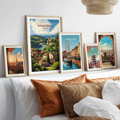 Dordogne Wall Art Print displayed among other travel prints in a modern living room setting.