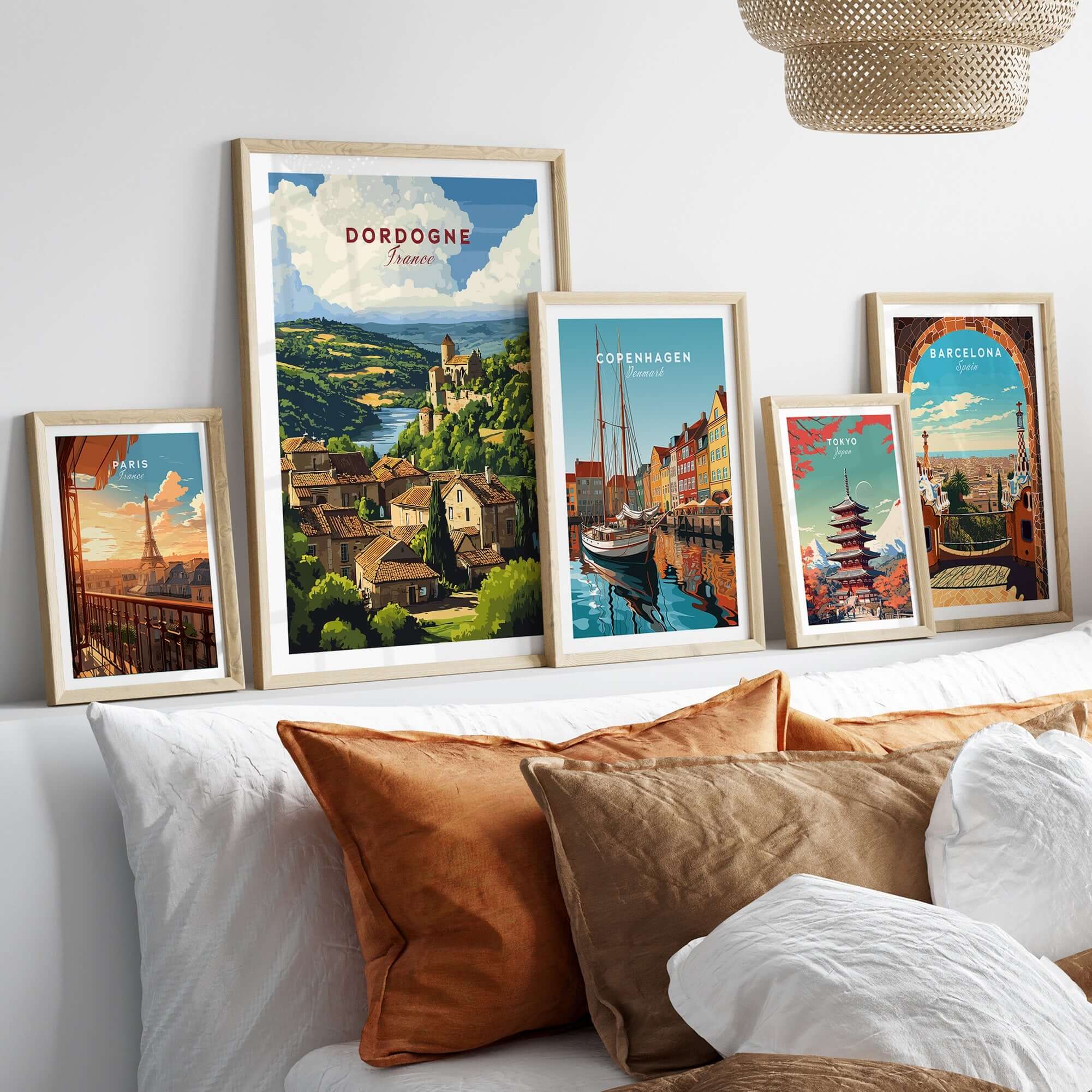 Dordogne Wall Art Print displayed among other travel prints in a modern living room setting.