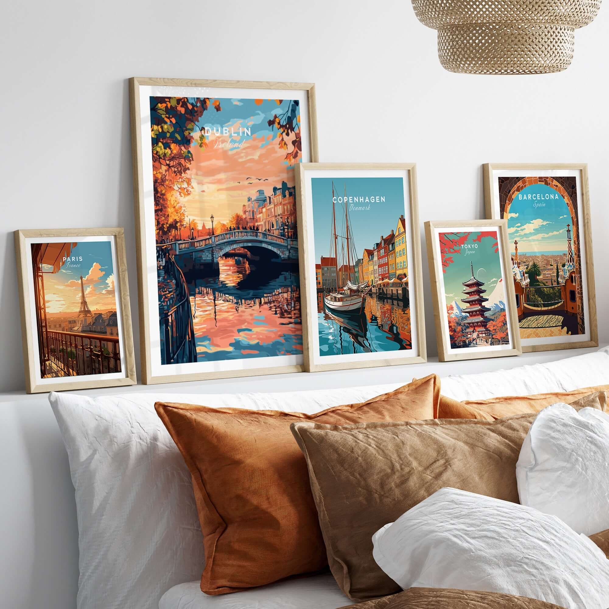 Dublin Art Print displayed among framed travel art prints on a cozy sofa showcasing vibrant colors and intricate details.