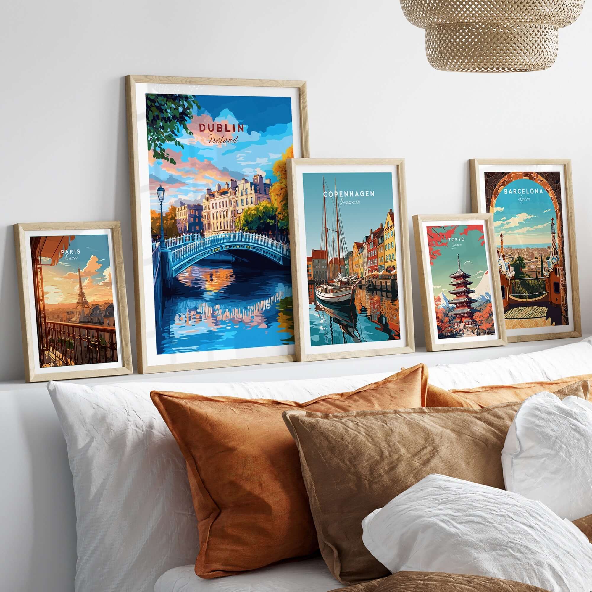 Dublin Travel Print displayed among other travel prints on a cozy couch, highlighting cityscapes and destinations.