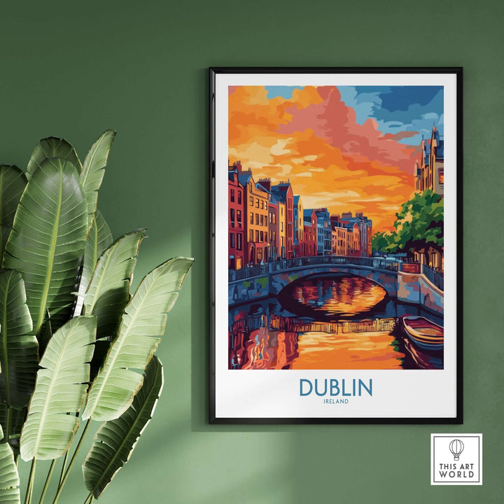 Dublin wall art poster featuring a vibrant sunset over a canal, framed and displayed with indoor plants.