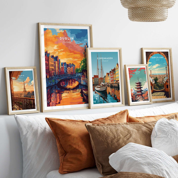 Dublin wall art print displayed with other city prints above a stylish bed with decorative pillows.