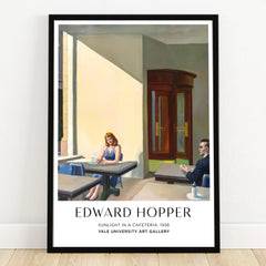 Framed Edward Hopper art print featuring 'Sunlight in a Cafeteria' with two people sitting indoors.