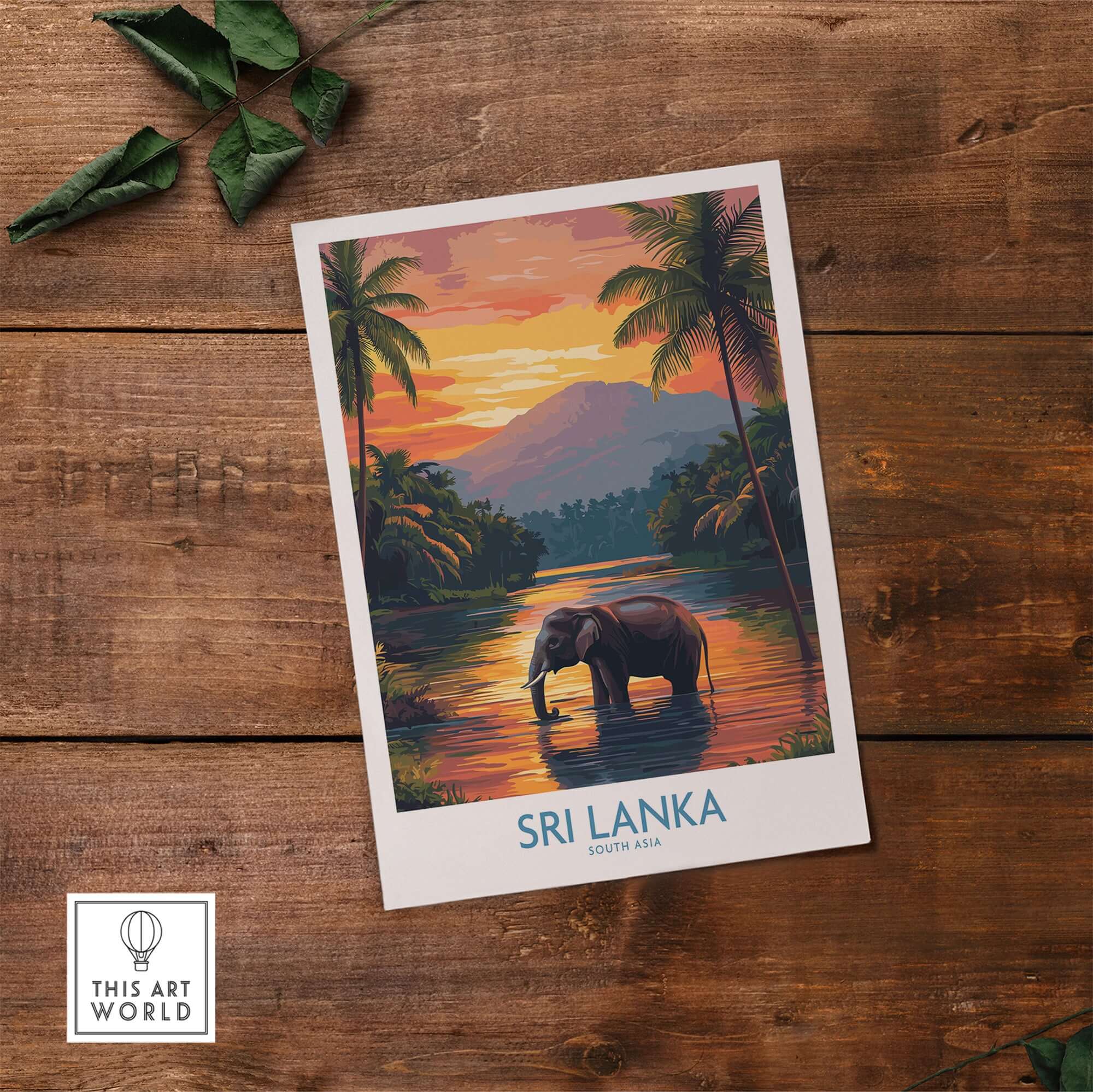 Elephant River Scene Print - Sri Lanka Travel Art, Tropical Wall Hanging displayed against a wooden backdrop.