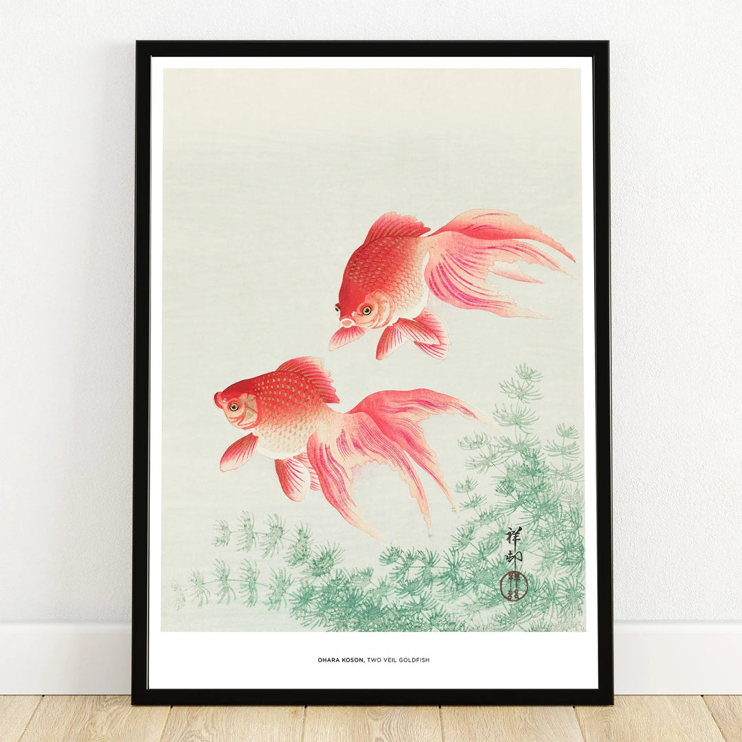 Framed wall art print of two red goldfish swimming above green plants, minimalist decor