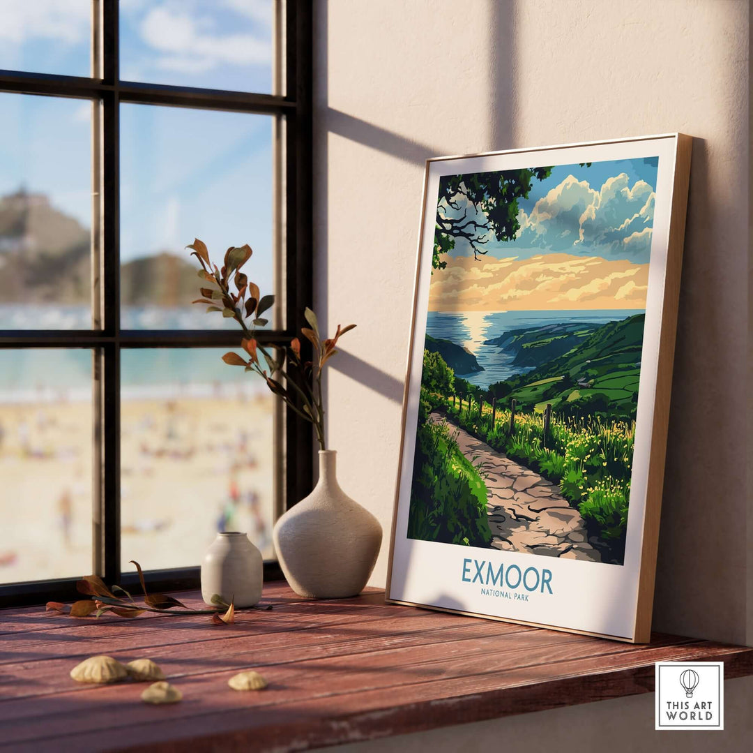 Exmoor England wall art print displayed on a wooden shelf near a window, showcasing lush landscape and vibrant colors.