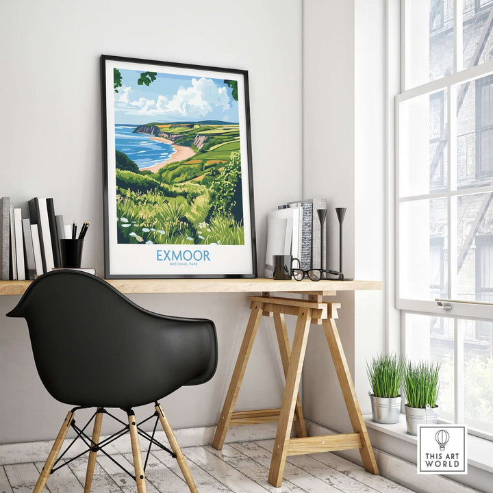 Exmoor National Park travel print framed on a desk, showcasing lush landscapes and coastal views in a modern home office.