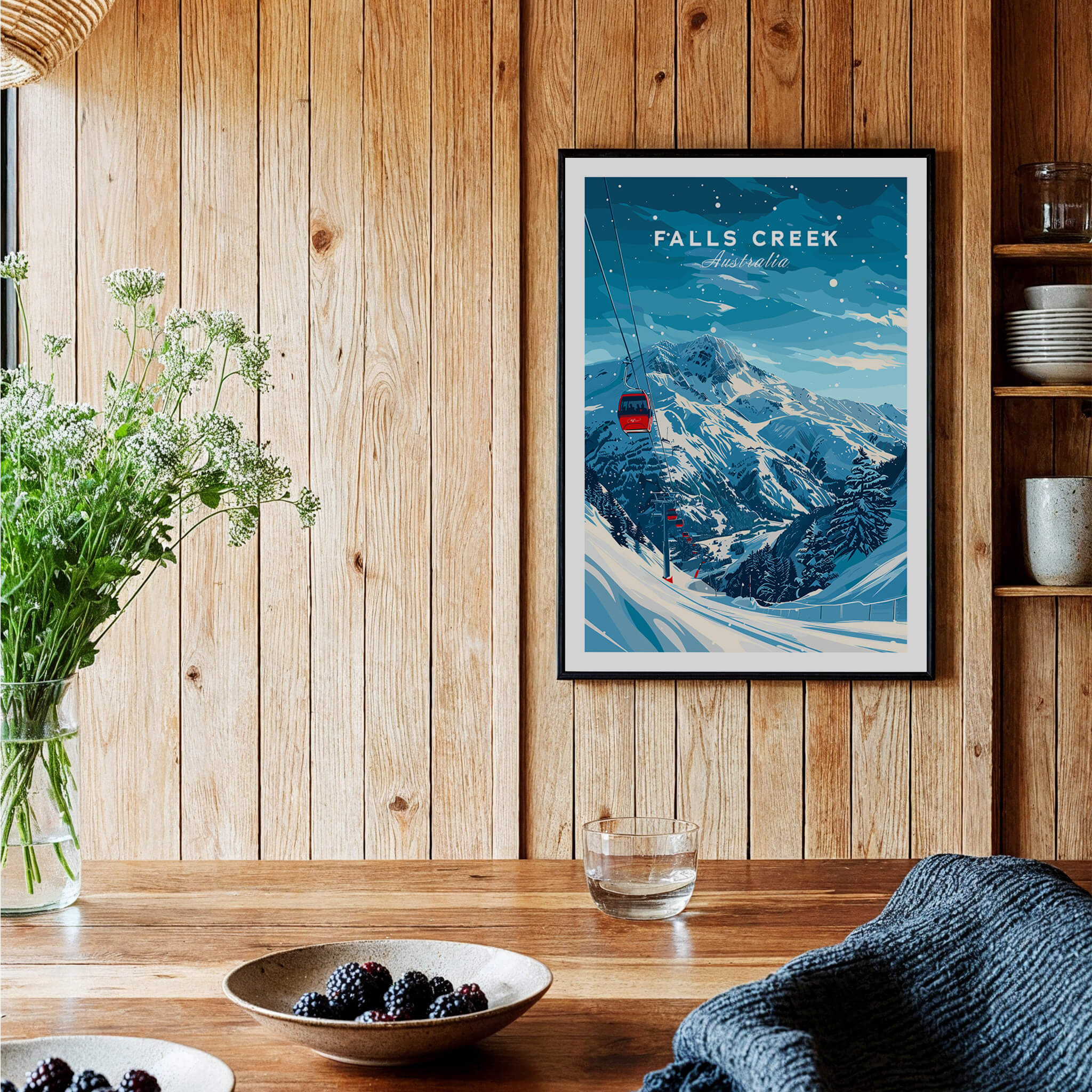 Falls Creek Travel Poster - Australia framed on a wooden wall, showcasing stunning skiing slopes and a chairlift.