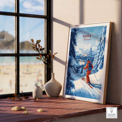 Framed Ruka ski run poster showing a skier in snowy peaks, perfect for Nordic travel decor and winter sports enthusiasts.