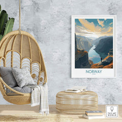 Modern Norwegian fjord wall art print displayed in a cozy interior setting featuring a hanging chair and rattan decor.