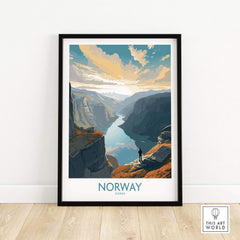 Framed Fjord Wall Art showcasing a stunning Norwegian landscape with a person standing on a cliff, vibrant colors and modern style.