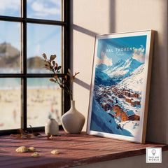 French Alps Ski Village Poster | Cosy Val Thorens Scene displayed in a sunlit room with a view of mountains.