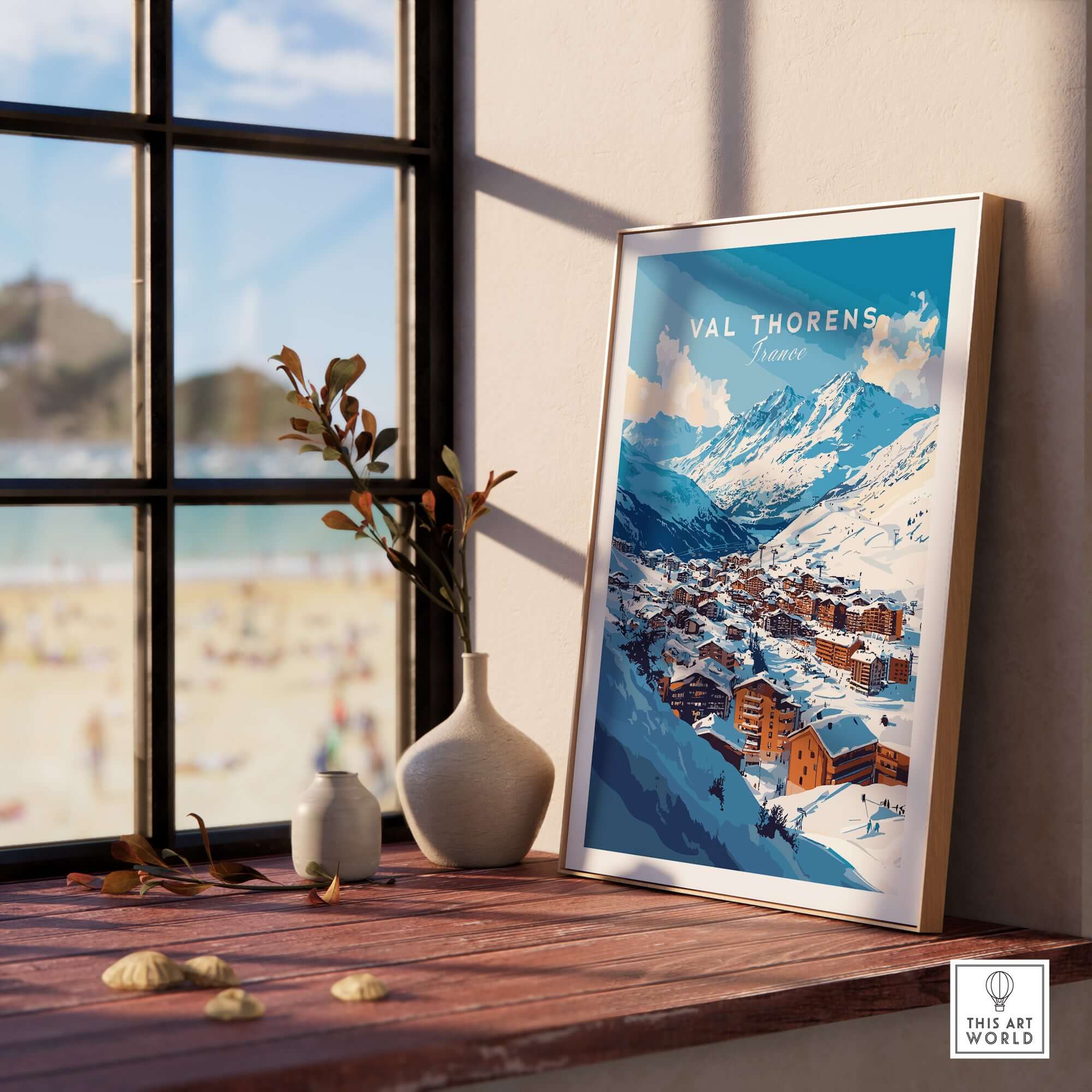 French Alps Ski Village Poster | Cosy Val Thorens Scene displayed in a sunlit room with a view of mountains.