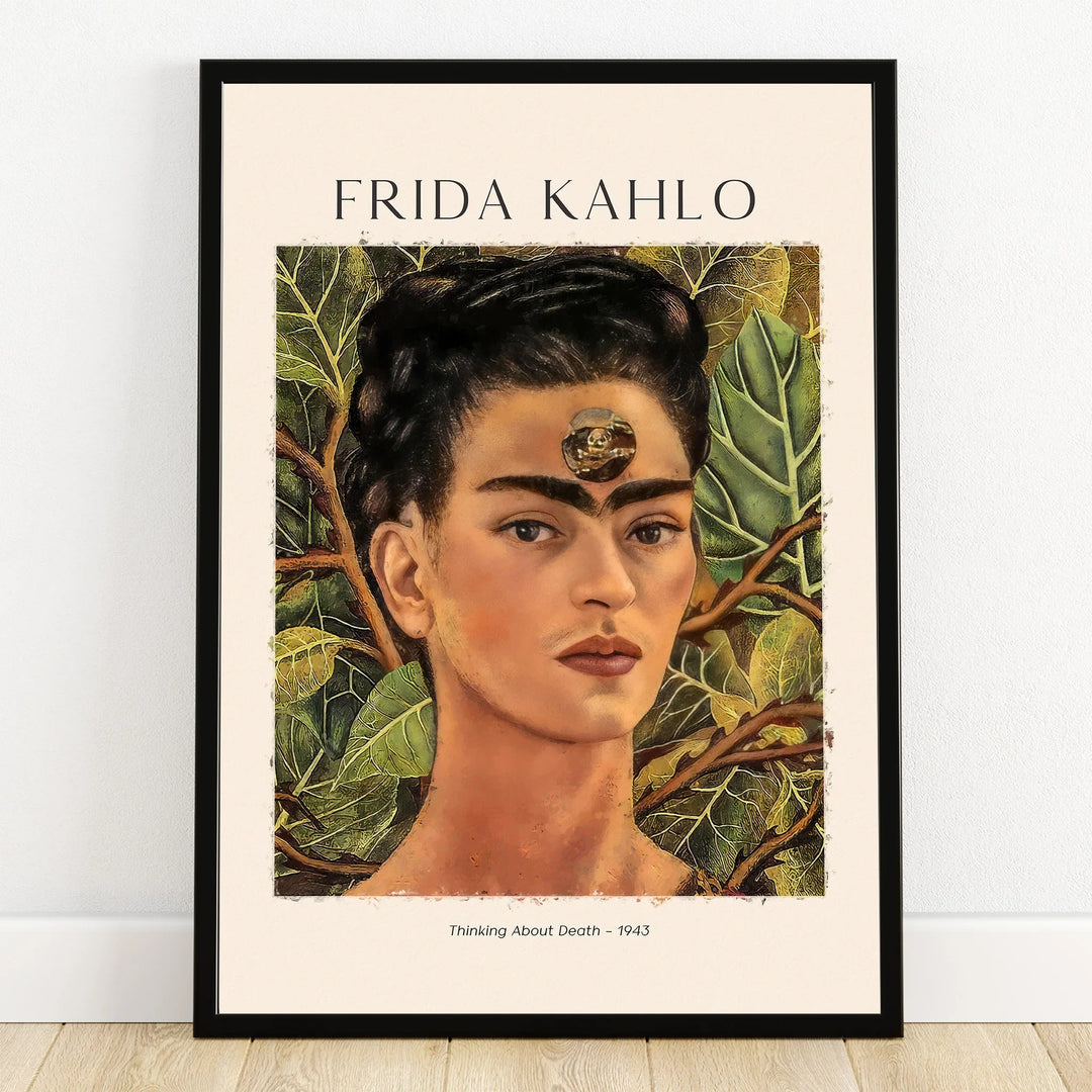 Framed Frida Kahlo portrait wall art with lush leaves, titled 'Thinking About Death 1943'.