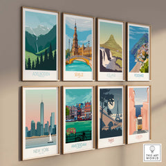 Gallery wall featuring travel-inspired wall art prints including Adelboden, Seville, Iceland, Positano, New York, and Paris.