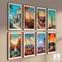 Framed travel poster prints featuring landscapes from Alonissos, Paris, Barcelona, London, Amsterdam, Florence, Tokyo, and Angkor Wat.