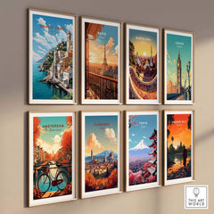 Wall display of travel posters featuring the Amalfi Coast, Paris, Barcelona, London, Amsterdam, Florence, Tokyo, and Angkor Wat.