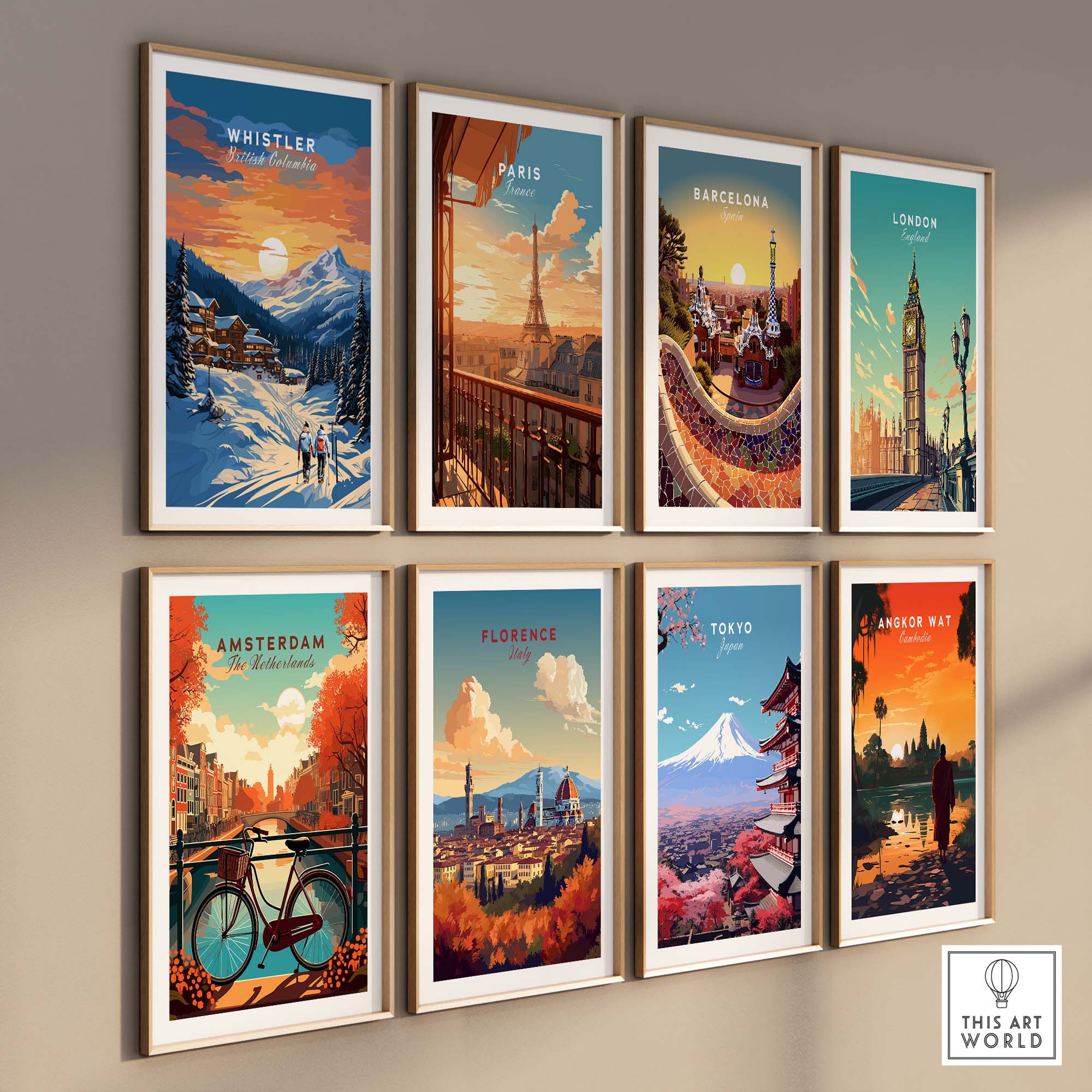 Collection of framed travel posters featuring Whistler, Paris, Barcelona, London, Amsterdam, Florence, Tokyo, and Banff on a wall.