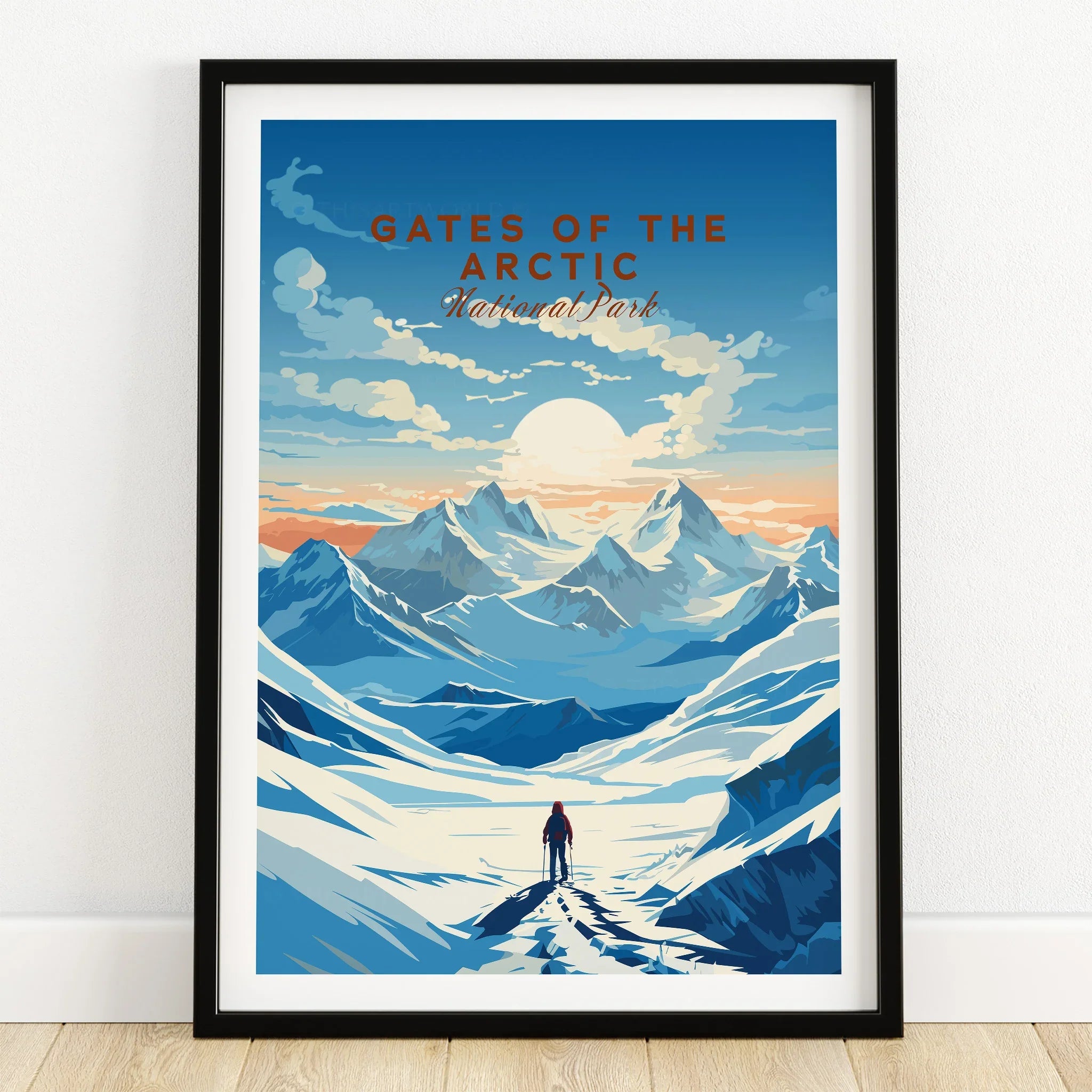 Gates of the Arctic National Park art print in black frame on wooden floor, snowy mountain landscape