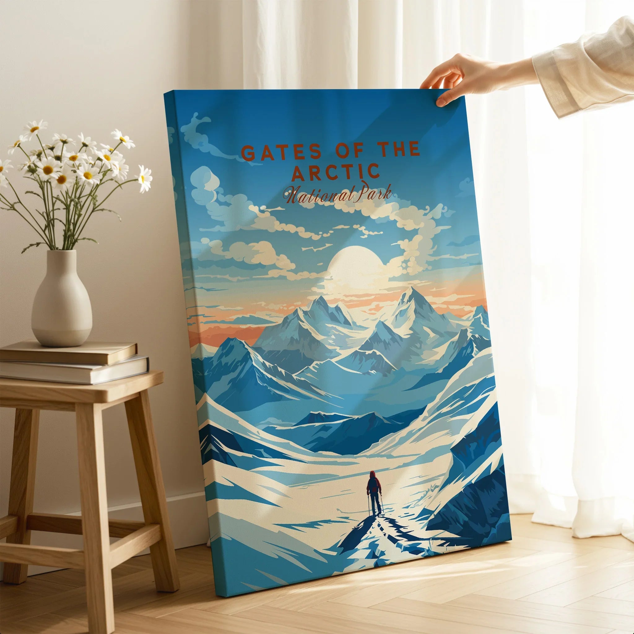 Gates of the Arctic National Park print with snowy mountains, held in a bright room