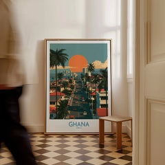 Ghana City Sunset Wall Art — framed canvas on floor man walking past