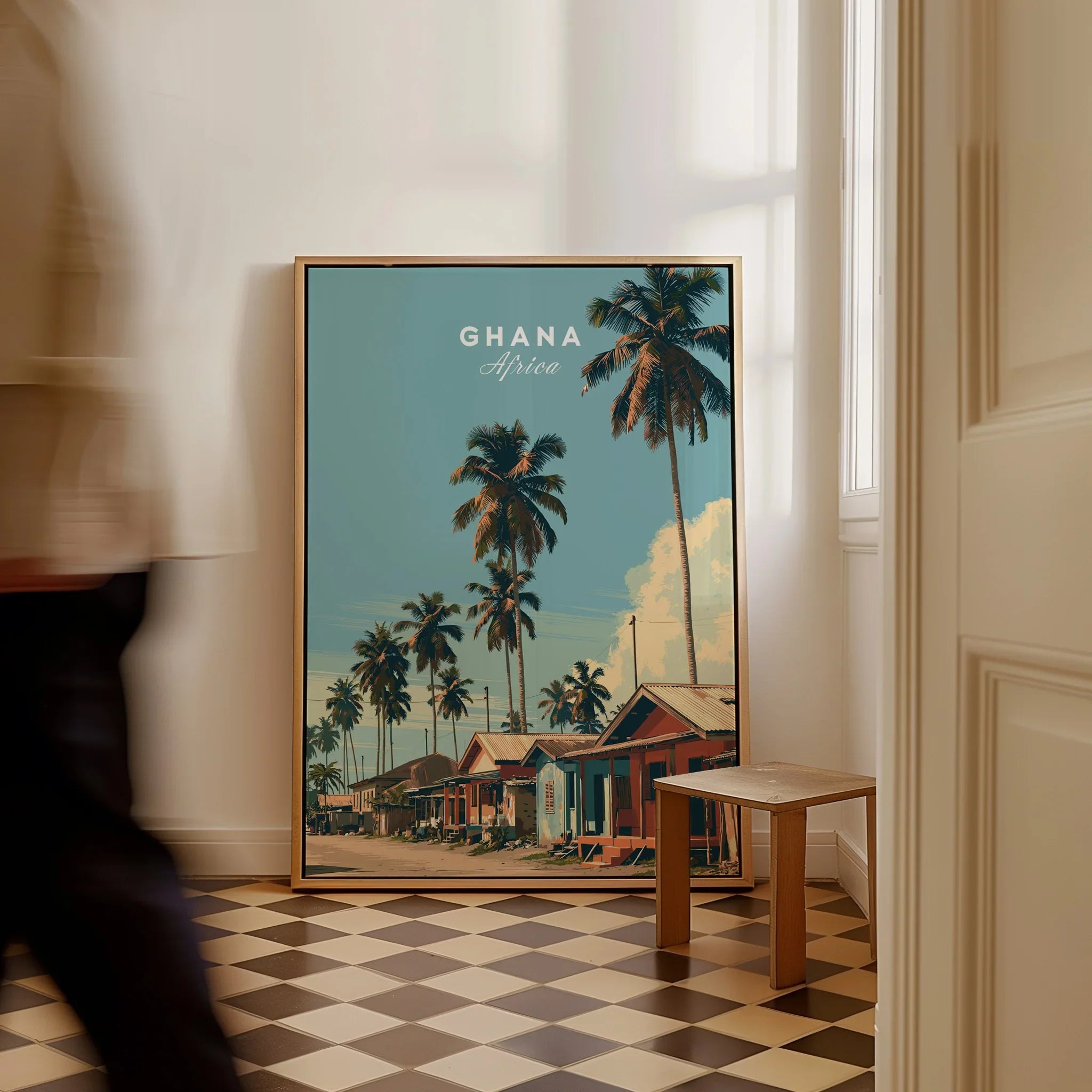 Ghana Coastal Village Travel Poster — framed canvas on floor man walking past