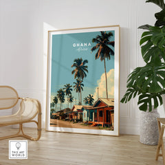 Ghana Coastal Village Travel Poster — large framed print room setting chair plant