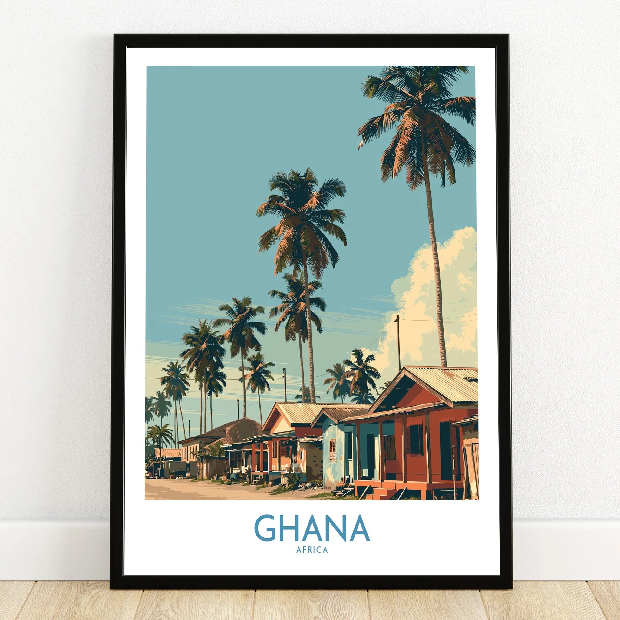 Ghana Palm Village Wall Art — art print in black frame on wooden floor
