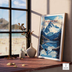 Glacier Bay Alaska Wall Art framed on a wooden table with a view of the beach and mountains in the background.