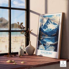 Glacier Bay Alaska Wall Art Print displayed on a wooden shelf near a window, showcasing stunning mountain scenery.