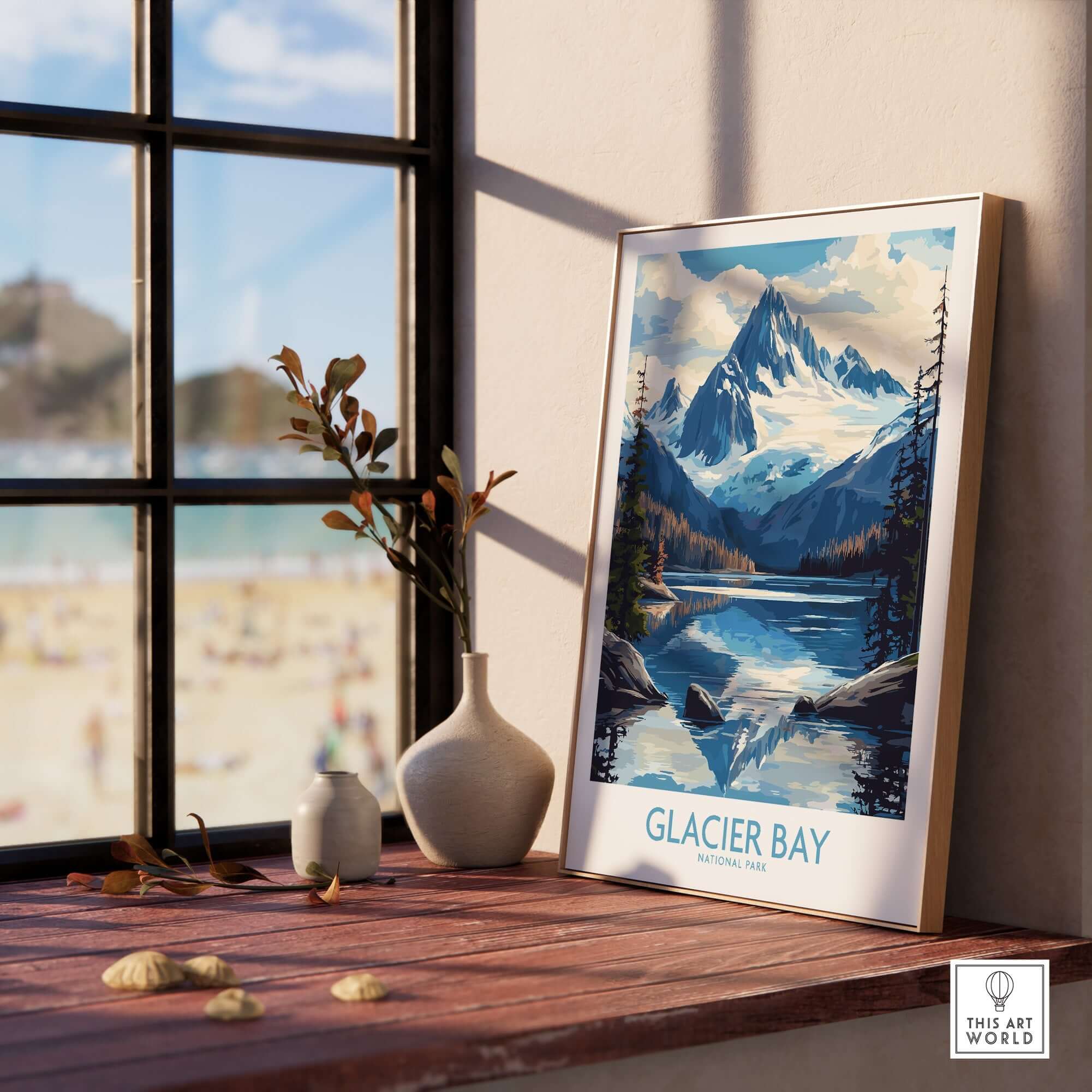 Glacier Bay Alaska Wall Art Print displayed on a wooden shelf near a window, showcasing stunning mountain scenery.
