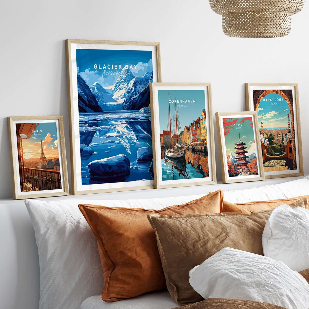 Framed prints of Glacier Bay, Copenhagen, and Barcelona showcased on a decorative bed, adding a touch of adventure to the décor.