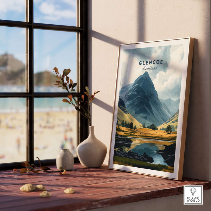 Glencoe Travel Print showcasing Scottish landscapes, framed by a sunny window and decorative home accents.