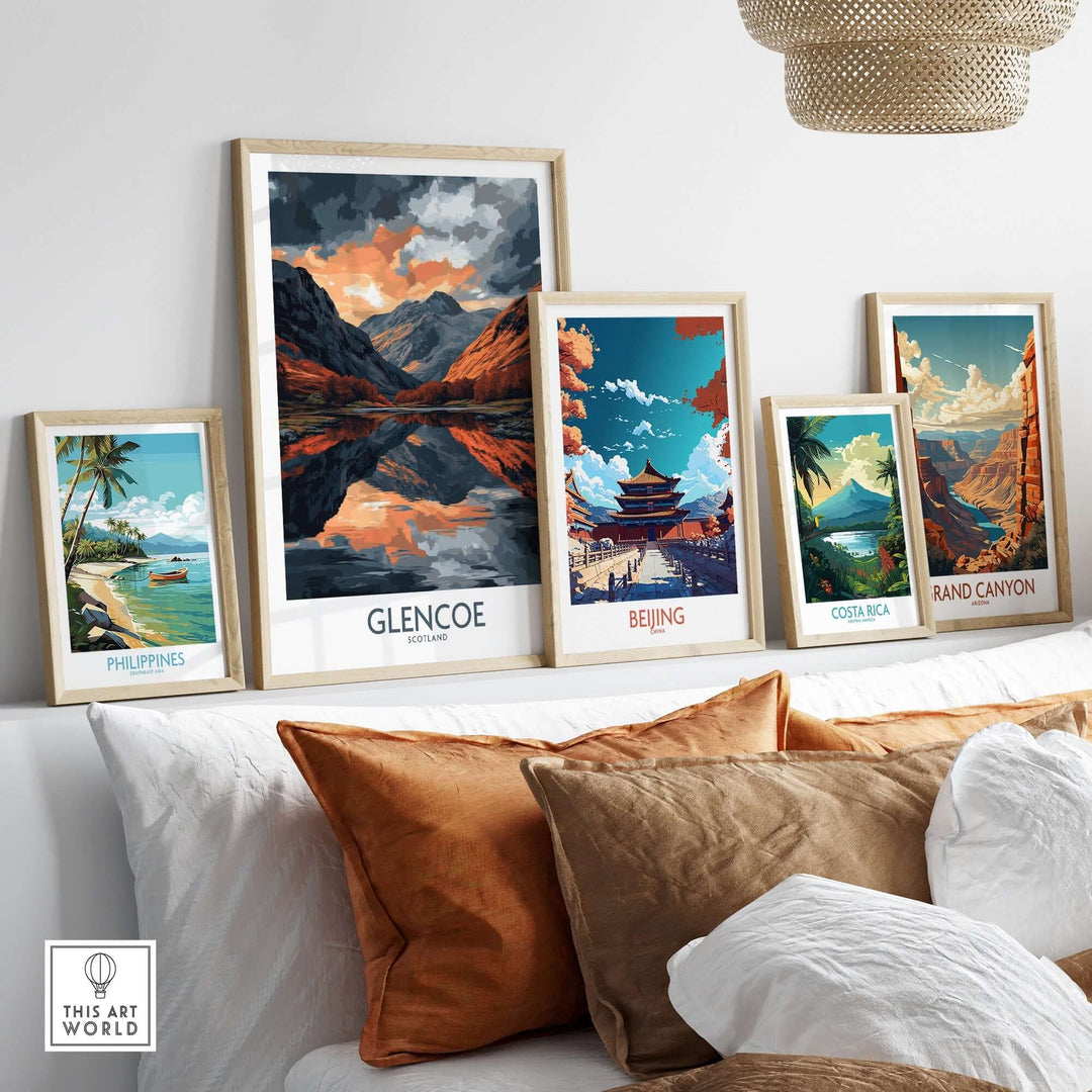 Glencoe wall art poster displayed among other scenic art prints on a stylish sofa, enhancing home decor.