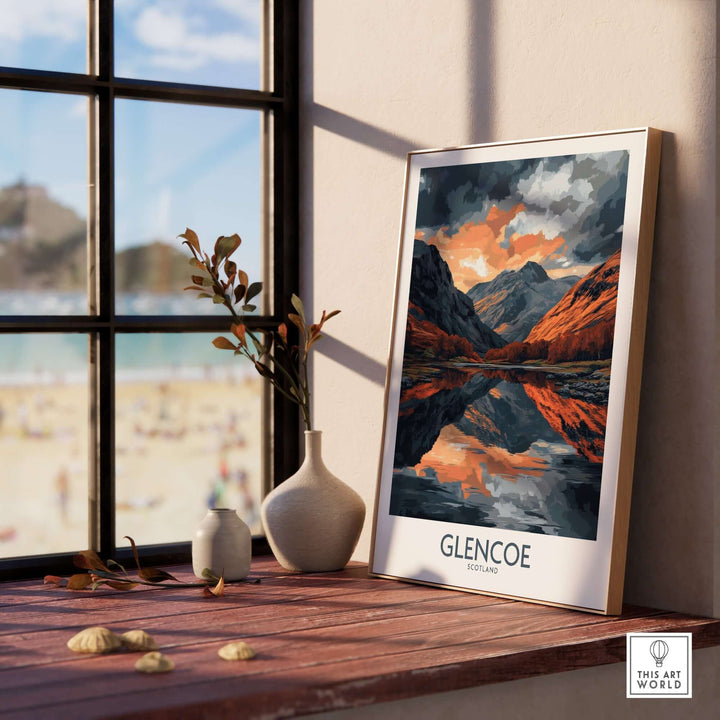 Glencoe wall art poster displayed by a window, showcasing a stunning landscape reflection, perfect for home decor.