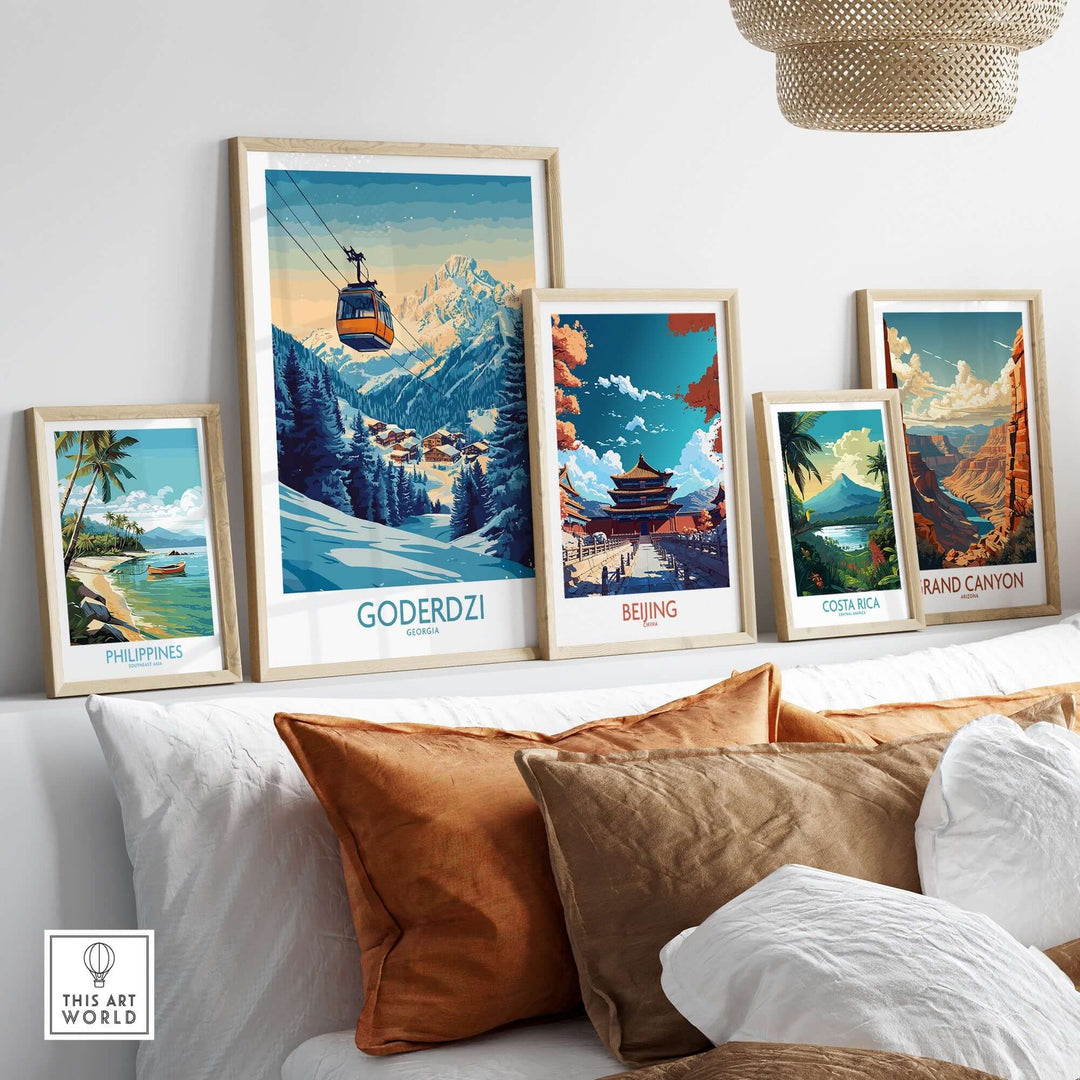 Framed Goderdzi poster among travel-themed art showcasing ski resorts and scenic landscapes in a stylish living room setting.