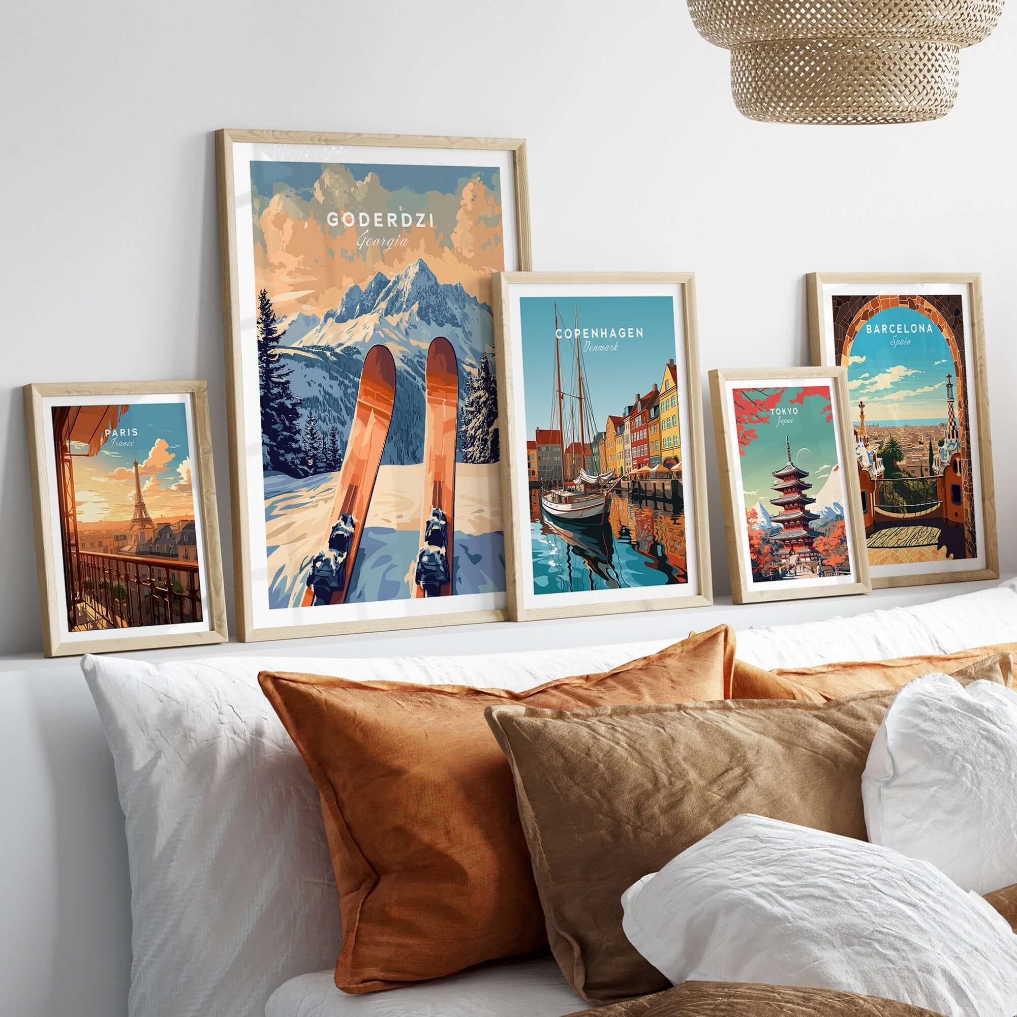 Goderdzi Ski Print showcased among framed travel posters in a cozy living room setting with decorative pillows.