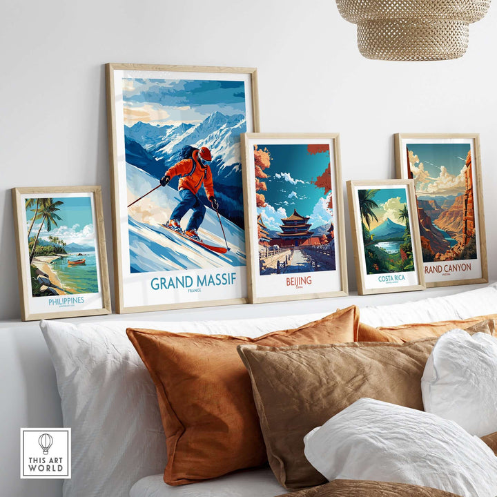 Framed Grand Massif ski poster among travel and adventure-themed art prints on a decorative shelf.