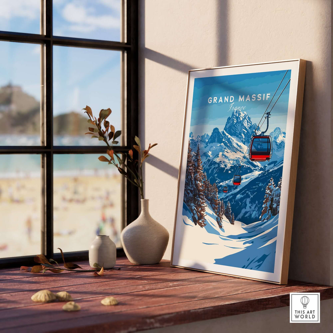 Framed Grand Massif ski print featuring a scenic mountain range and ski lift near a sunny window.