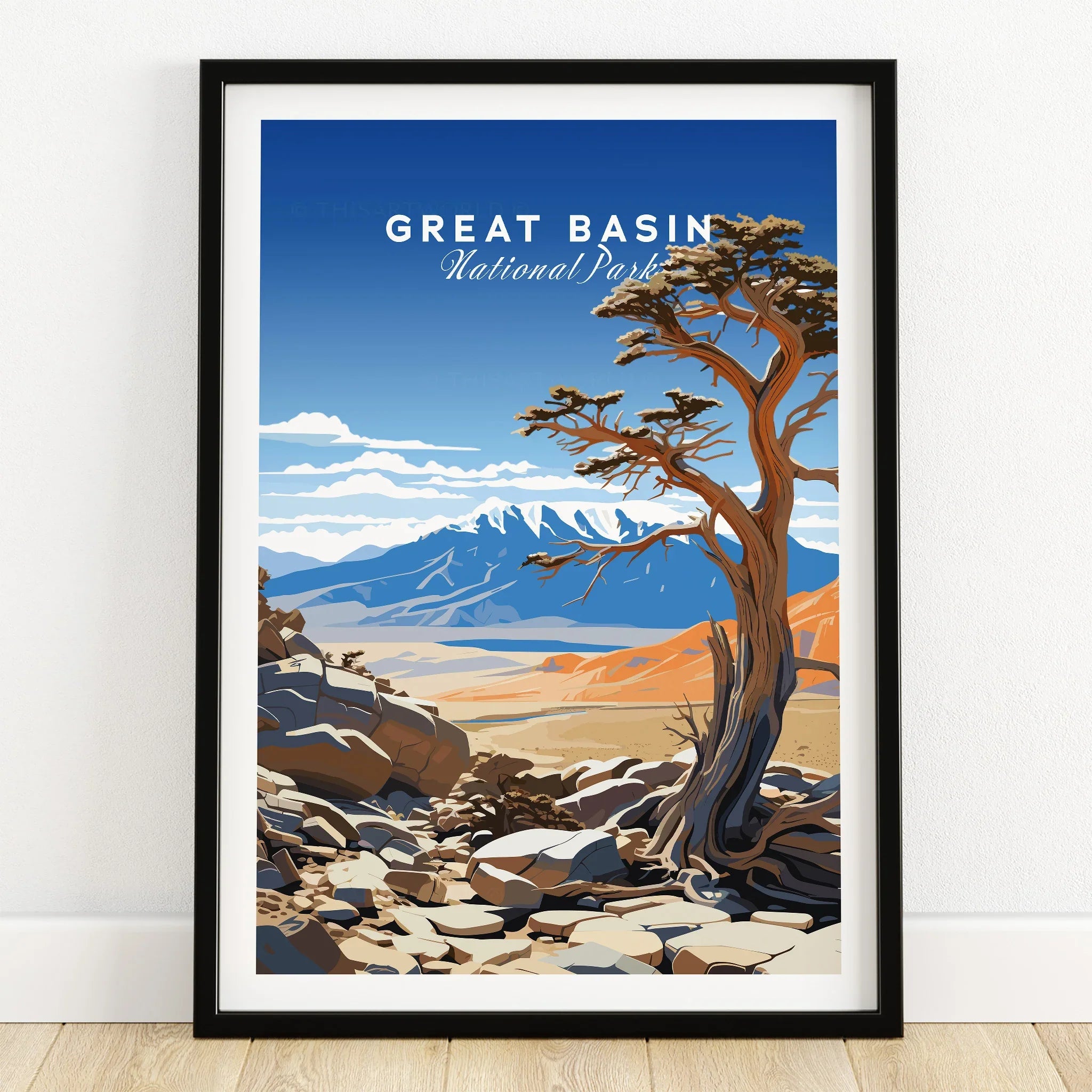 Great Basin National Park art print in black frame on wooden floor, showing desert landscape and tree.