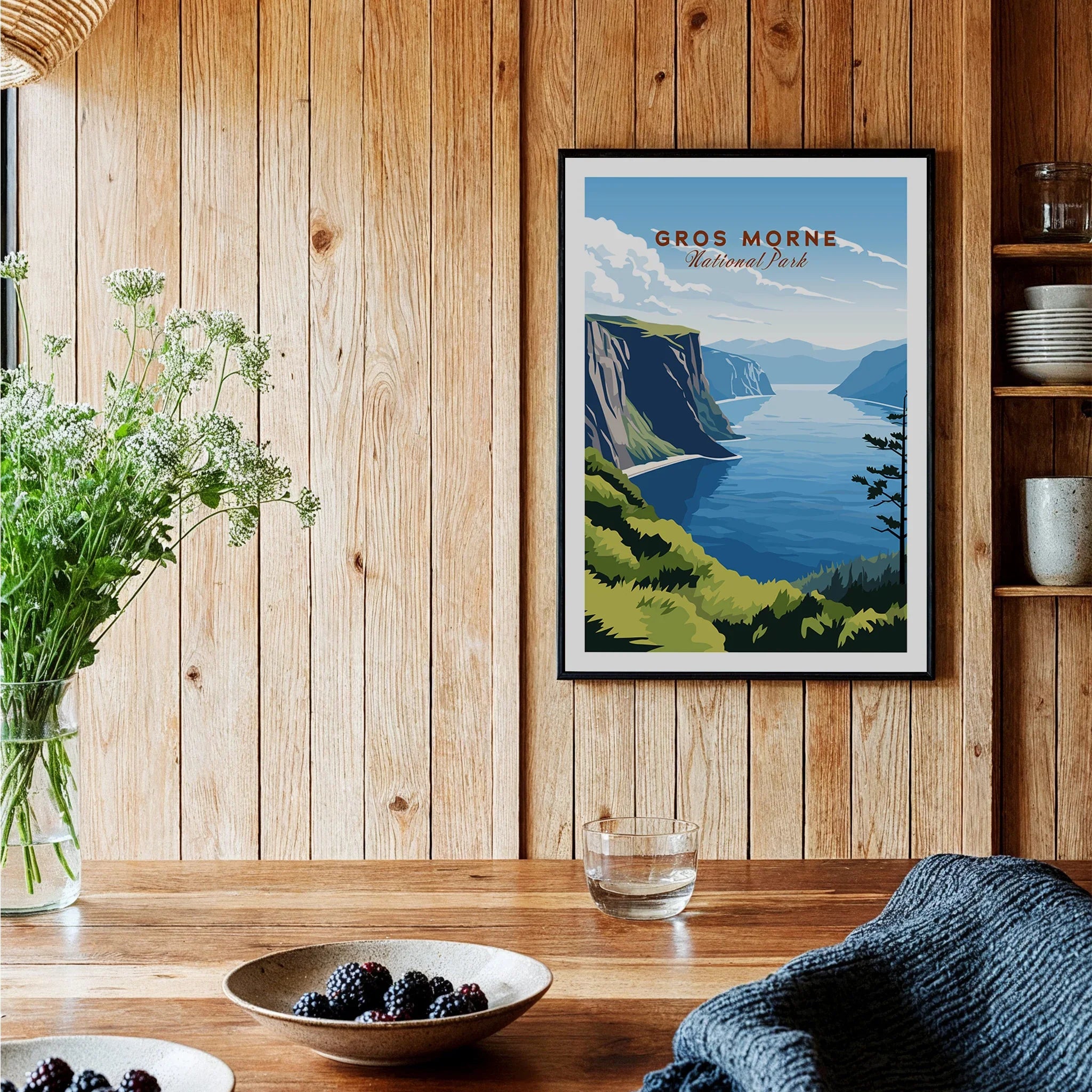 Framed Gros Morne National Park art print on wood wall in cozy kitchen setting