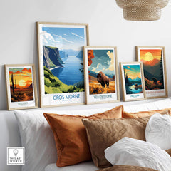 Colorful national park prints with landscapes and wildlife on a modern living room wall.