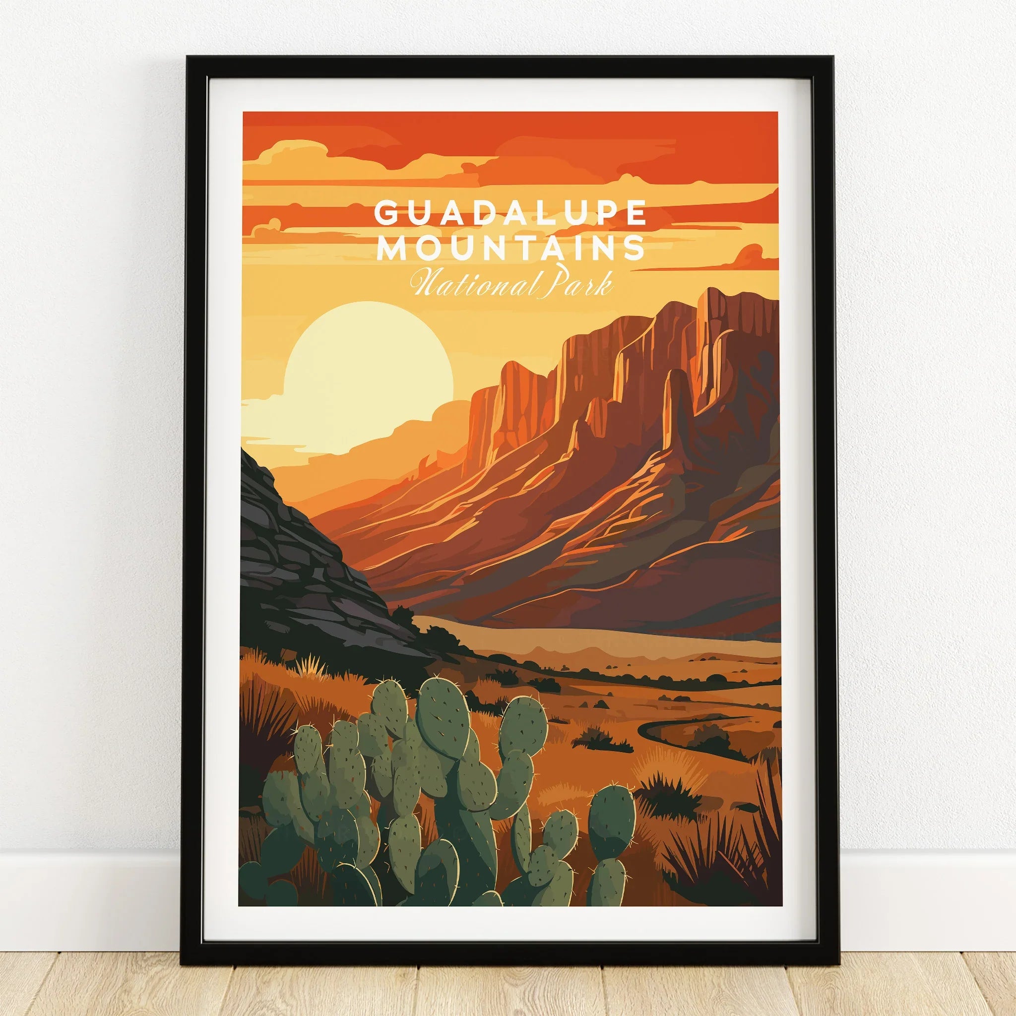 Guadalupe Mountains National Park art print in black frame, desert landscape with cacti and sunset.