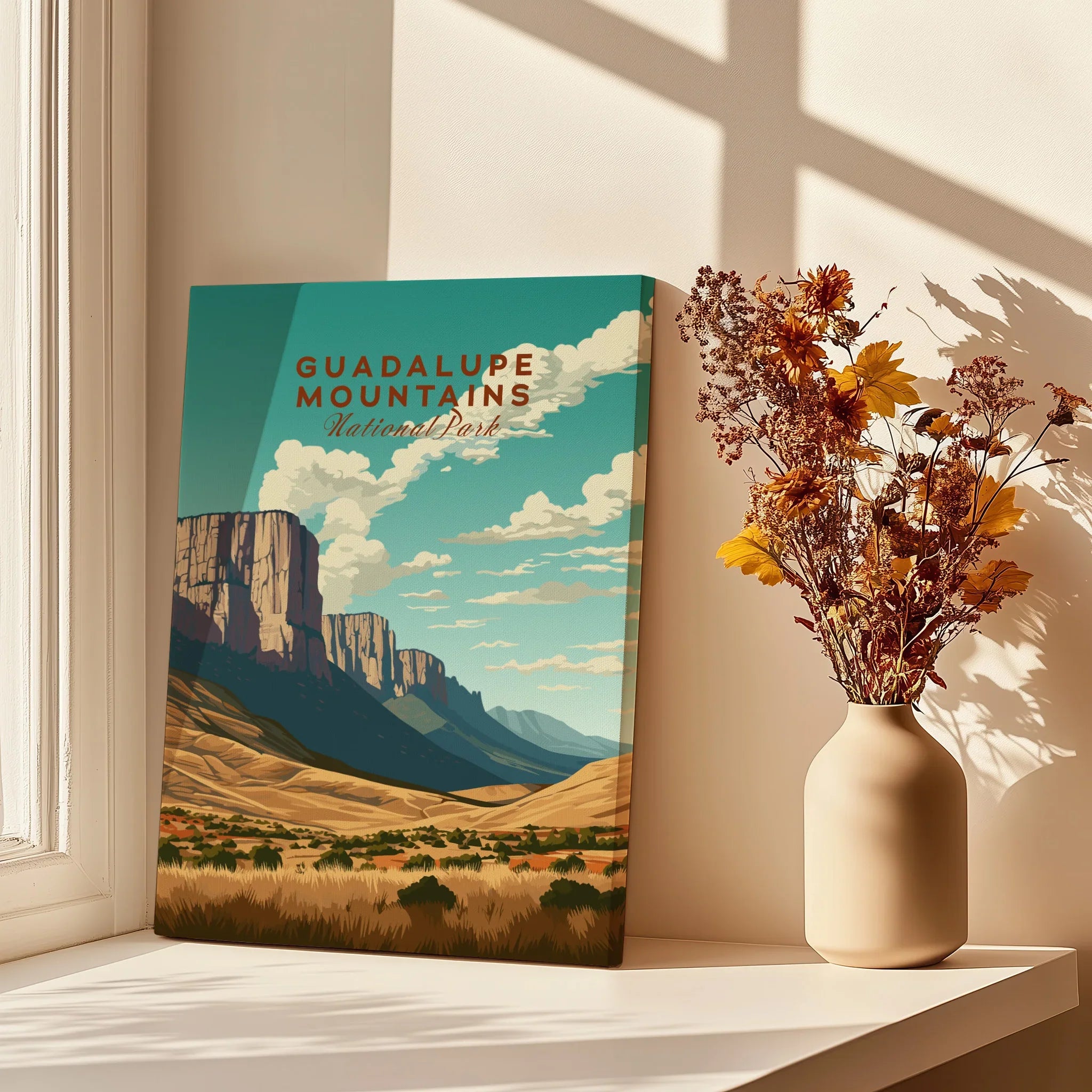 Guadalupe Mountains National Park poster on windowsill with vase of dried flowers, home decor