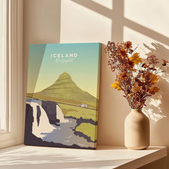 Iceland Kirkjufell travel poster print with mountain, waterfall, and car, styled on windowsill with dried flowers.