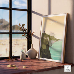 Ireland Print | Wall Art Travel Poster displayed in a bright room overlooking a beach scene.