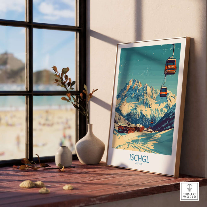 Ischgl Ski Poster displayed on a wooden table near a window, showcasing a snowy mountain landscape and ski gondolas.