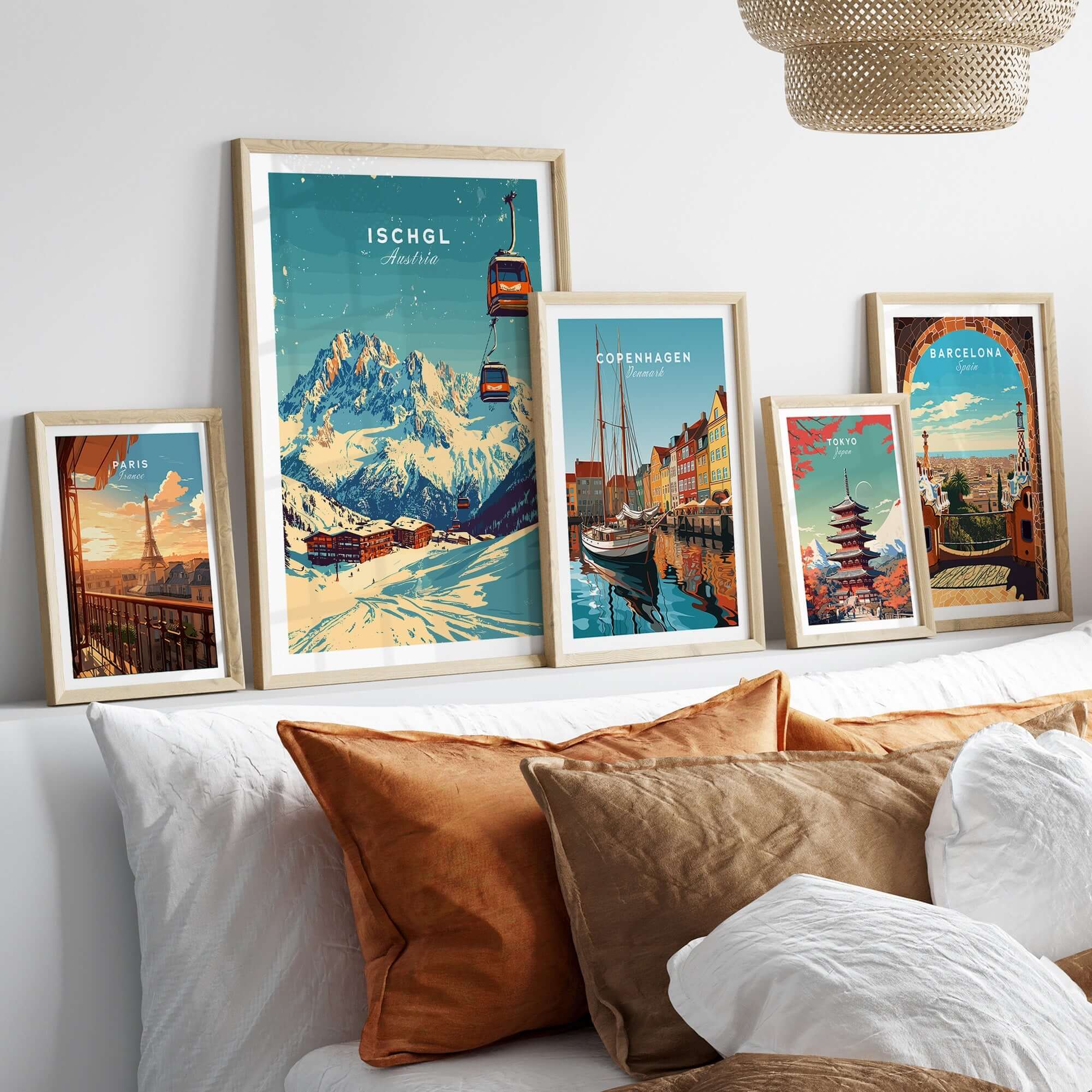 Ischgl Ski Print artwork displayed among other travel prints on a cozy sofa, highlighting stunning mountain views.